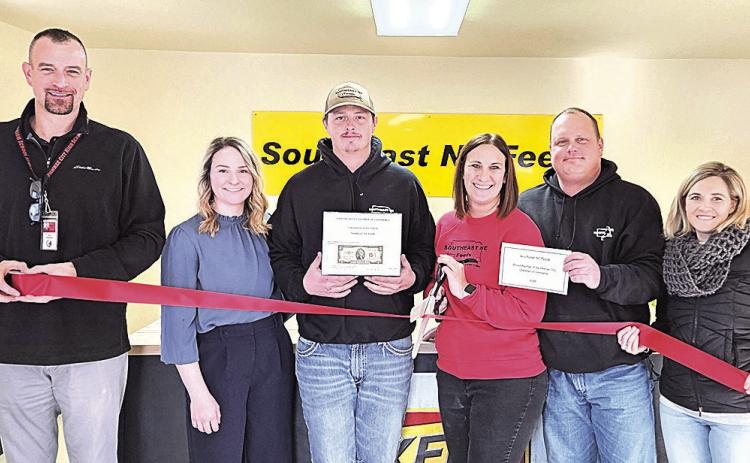 The Pawnee City Chamber of Commerce joined Southeast NE Feeds for their grand opening yesterday. As part of ceremonies, the Chamber sponsored a ribbon cutting and awarded Southeast NE Feeds first-year membership in the Chamber and a certificate of new business. Pictured L to R: Brian Rottinghaus (Chamber rep), Shelby Barnes, Kaden Barnes, Joni Hegemann, Jesse Hegemann, Amanda Niss (Chamber rep)
