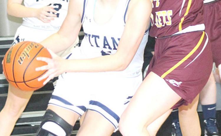 HTRS’ Ellie Schaardt (#5, left) drives past a Sterling defender as teammate Saydee Hardesty (#12, left) looks on. HTRS came up short, 30-47 against Sterling. photo by Paula Jasa/Republican
