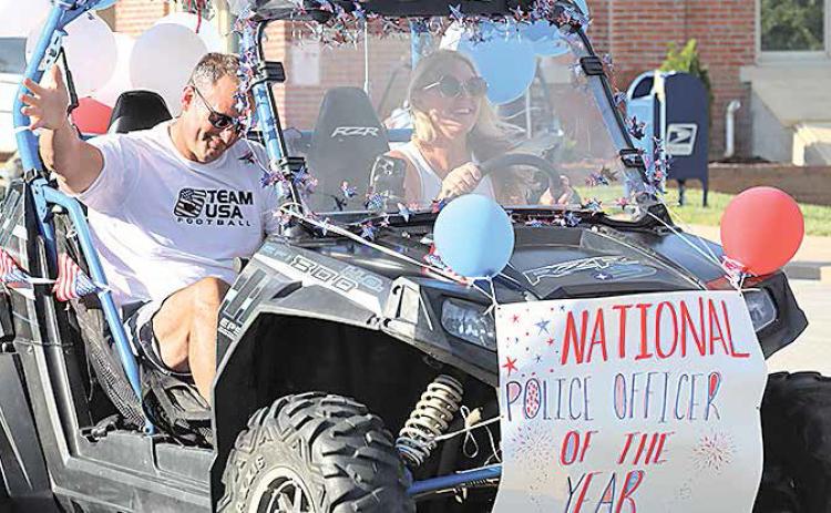 Sgt. Shane Maloley, the Steinauer Parade Grand Marshal, was named the National Law Enforcement of the Year by the American Legion. Evelyn Fink riding her tricycle in the parade.