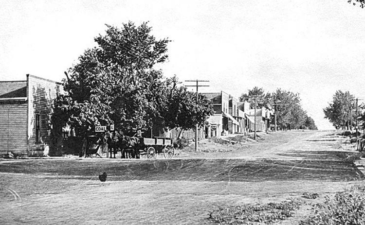 Below: Vintage postcard showing downtown Burchard circa 1909, soon after Frank Doering sold his meat market and ice house to Gotlieb Steinauer. The telephone had arrived in Burchard. The Burchard Times newspaper had Phone No. 12.