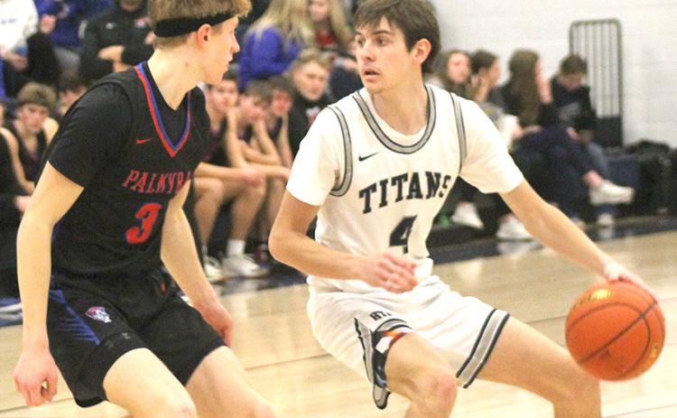 HTRS’ Jack Hunzeker (#4, right) looks to make a pass against a Palmyra defender in Friday night’s last home game. Paula Jasa/Republican