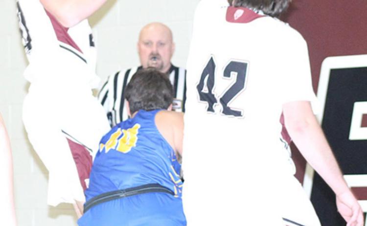 LHS’ Caleb Rule (left) and Ethan Horne (#42, right) team up on defense on the baseline against T-C. Paula Jasa/Republican