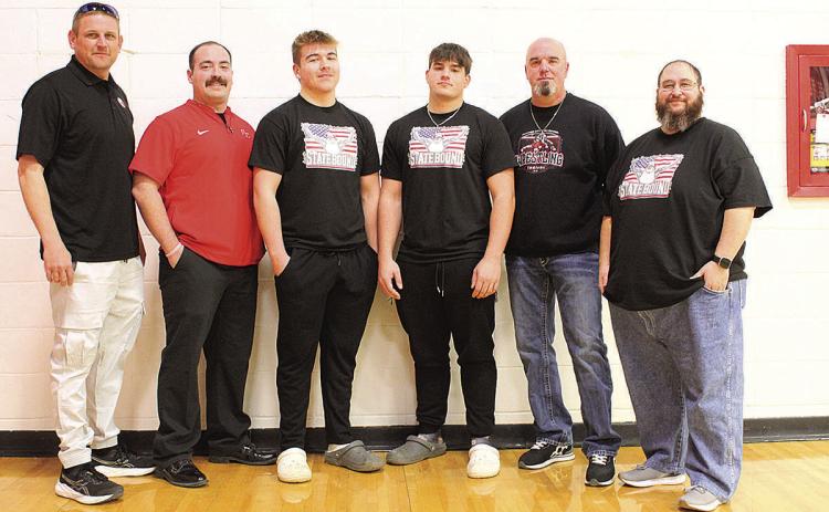 The Pawnee City Wrestling Team enjoyed a pep rally at the school before heading off to the competition in Omaha. From left to right: Coach Jacob Schuetz, Assistant Coach Koalton Taiclet, Sophomore Gauge Schuetz, Junior Dylan Layne, Assistant Coach Michael Layne and Assistant Coach Jacob Otero.