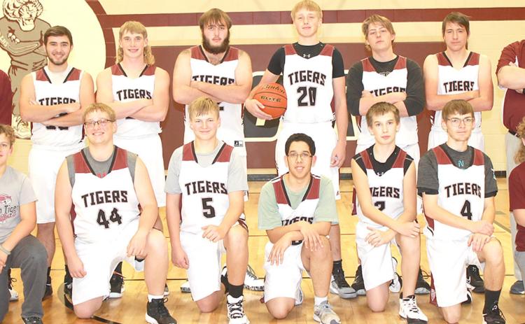Members of the 2021-22 Lewiston Boys’ Basketball Team are front, from left: Brock Janssen, s.m., Jaxon Janssen, Everett Bohling, Draco Quintana, Ashton Sanders, Ethan Bohling, Grady Weyers, s.m. Back row: Head Coach Kohlton Gabehart, Brady Bledsaw, Tristen Ray, Ethan Horne, Caleb Rule, Ty Arena, Johnathan Burgett, Asst. Coach Matthew Sholty. Not pictured: Freddie McMurray.