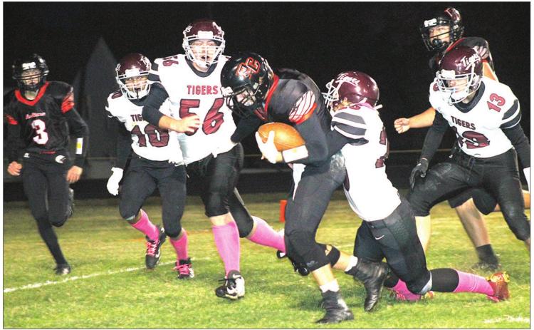 Pawnee City’s Kyle Gyhra (center) takes off on a run as Lewiston’s Brady Bledsaw (#13, right), Tristen Ray (tackling), Ty Arena (#56) and Gabe Garcia (#10, left) try to chase him down. Also pictured is P.C.’s Kylenn Koester (#3, left) running to help out. Paula Jasa/Republican
