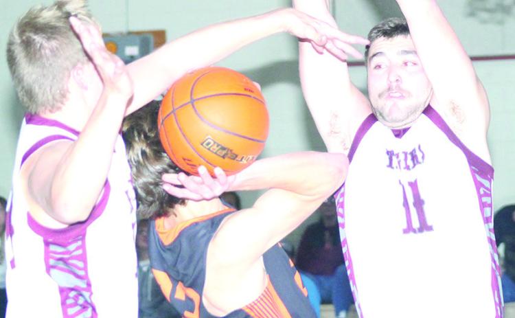LHS’ Everett Bohling (left) makes a big block against a Diller/Odell player as teammate Brady Bledsaw (#11, right) goes up to do the same. Paula Jasa/Republican
