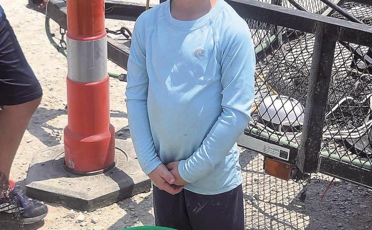 First Place winner for ages 2-9, Oliver Rauner and his winning bucket of fish.