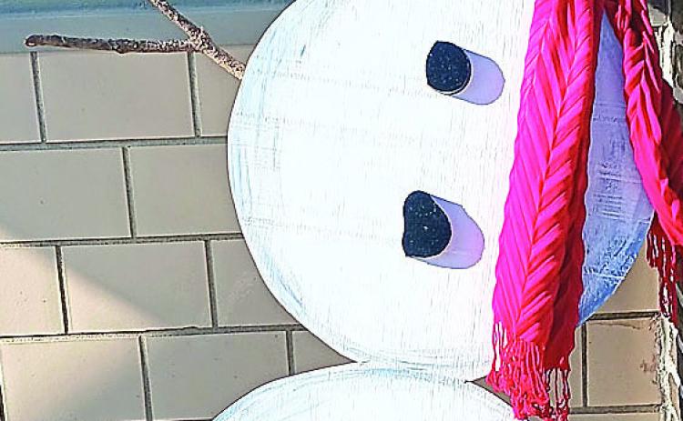 The Missing Sock Snowman stood in for real snow during the Christmas season in Pawnee City, but after he was taken down and put away for another year Old Man Winter brought us some real snow. With school canceled Monday and Tuesday the snow was nice and wet, perfect for children to make snowmen and for that matter. snowballs.