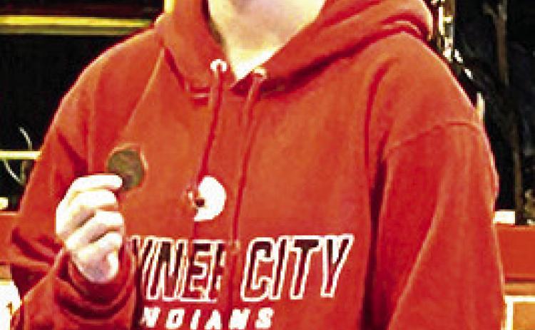 P.C.’s Kaylee Turnbull shows off her 3rd place medal at the Warcat Invitational last week. Photo courtesy of Jamie Maloley