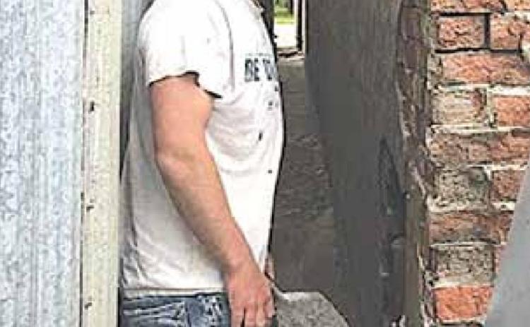 Brick mason Brandon Schawang doing some critical repair at the back of the building. Sharla Sitzman Photo