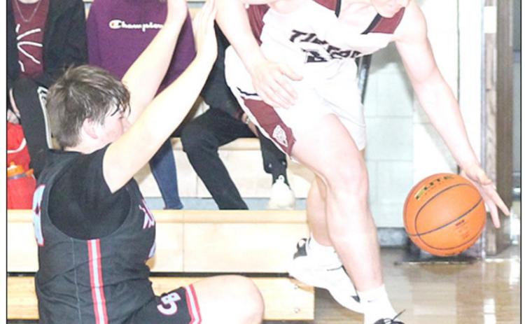 LHS’ Hayden Christen (right) gets fouled driving the baseline against Cedar Bluffs Friday night. Christen led Lewiston with 19 points in the 46-31 victory. Paula Jasa/Republican