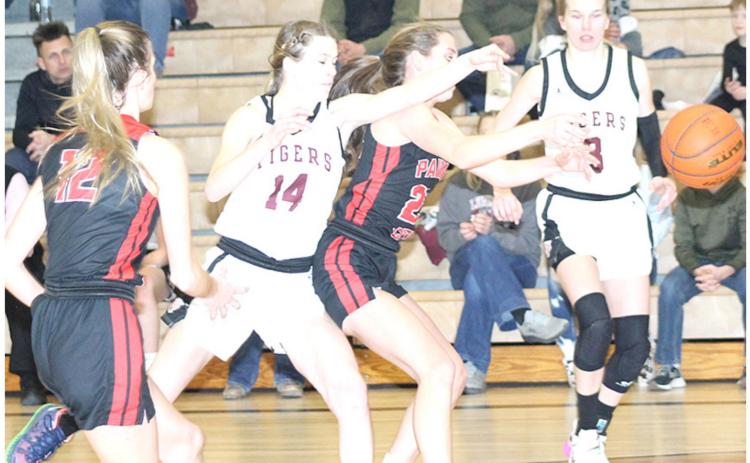 LHS’ Meagan Sanders (#14, left) goes up against P.C.’s Madison Lytle (#23) for a loose ball as P.C.’s Mallory Branek (#12, left) and LHS’ Katelyn Sanders (#3, right) look on. Paula Jasa/Republican