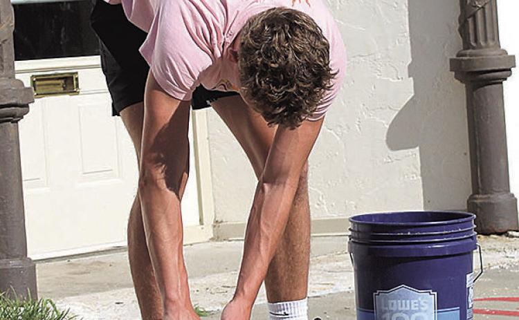 High school students Jace and Payton help City Councilwoman Susan Eisenhouer tidy Pawnee City sidewalks. "Every thing they do is one less thing the city crew has to do," Eisenhouer said.