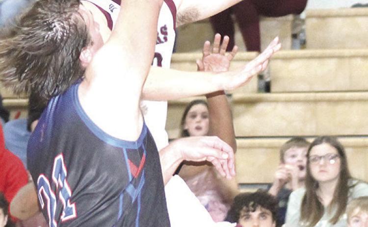 LHS’ Everett Bohling glides in for quick layup as the buzzer sounds at the end of the 3rd period. Bohling led Lewiston with 26 points in their thrilling 66-61 victory. Paula Jasa/Republican