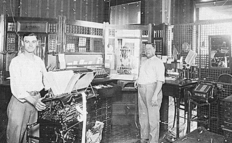 Above: Lawrence Duder &amp; Guy Bonham behind the bank counter, circa 1924