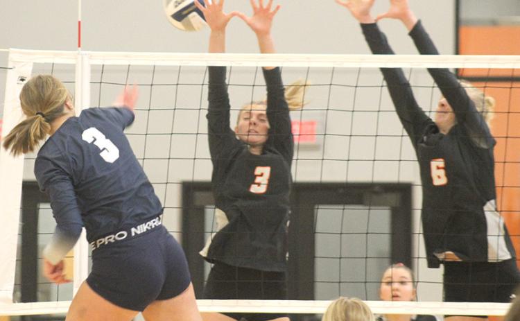 HTRS’ Macy Vrtiska (#3, left) drills a kill down the line against Diller/Odell in the Pioneer Conference Championship game. Vrtiska had 5 kills in the match. Paula Jasa/Republican