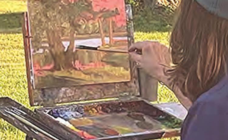Debra Joy Groesser demonstrates how to paint at the Paint Out event in Auburn last week. She is President of a the American Impressionist Society and a well-known professional artist.