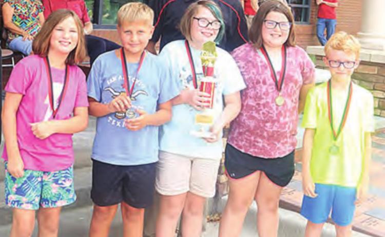 These fifth graders read 472 books total in the Summer Reading Program, besting everyone else. They get a trophy now to keep in their room. They are pictured with their teacher, Hadley Sejkora. From left, Addison Boverhuis, Derek Porter, Bella Thompson, Lila Yunghans, Zeke Ferebee. Ray Kappel/Republican