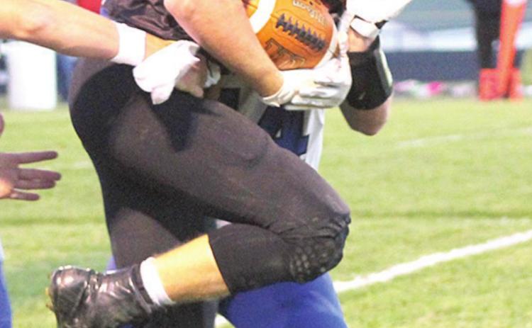 Pawnee City’s Kyle Gyhra fights for extra yardage while breaking tackles against Wallace on Friday night. Paula Jasa/Republican