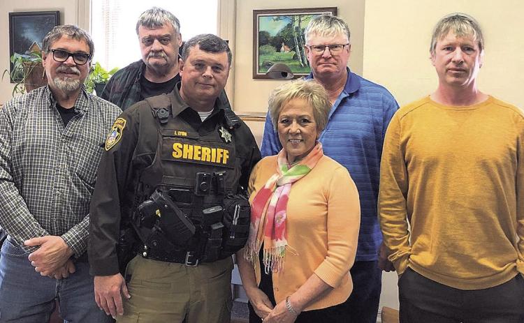 Pictured above: Dave Borrenpohl, Chairman of the Board, Les Agena Commissioner, Sheriff Lynn Lyon and his wife Mary Lyon, Tim Weber Commissioner, and County Attorney Ben Beethe.