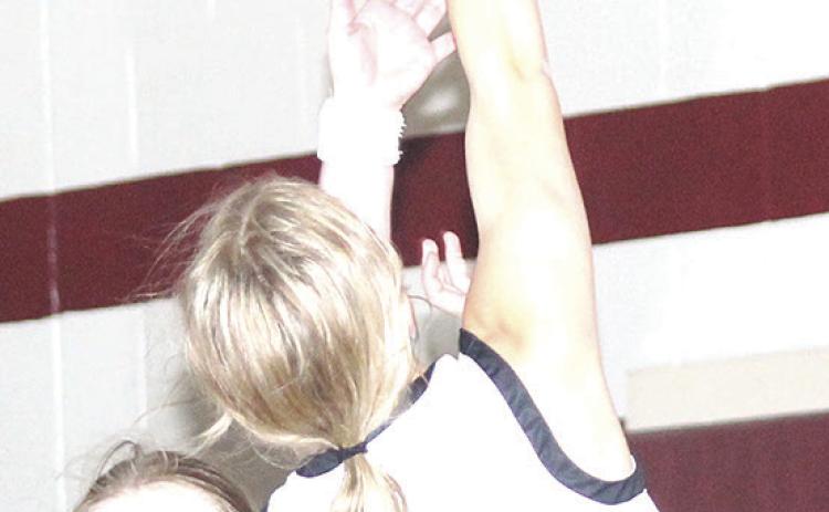 LHS’ Justice Currie (#2, right) goes up for a fast break shot against Sterling. Justice scored 13 points against Sterling on Parents’ Night. Paula Jasa/Republican