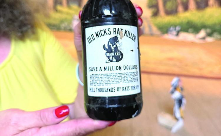 Above: Empty bottle of Old Nick’s Rat Killer found in an attic at the Table Rock Opera House. Manufactured in 1945, its label proclaims hits rats and mice like “the atomic bomb.”