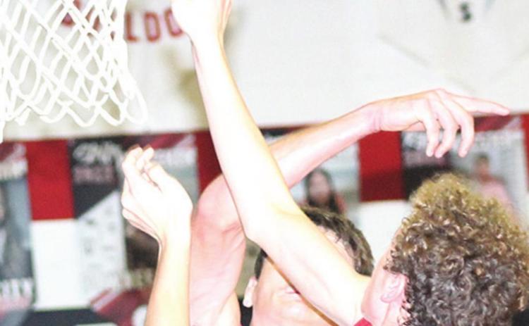 P.C.’s Bryce Gyhra gets a big block against Frankfort in Friday night action Paula Jasa/Republican