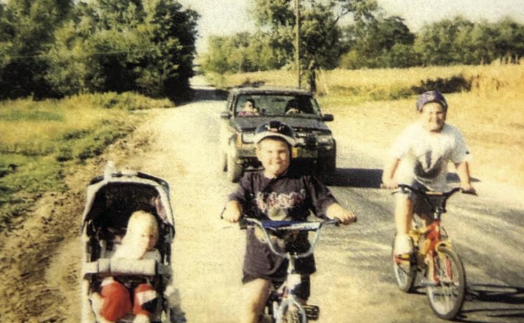 The photo Tammy staged with her children. She credits this photo for earning Pawnee City the grant to build the Dr. Rick Jackson trail Photo courtesy of Tammy Curtis