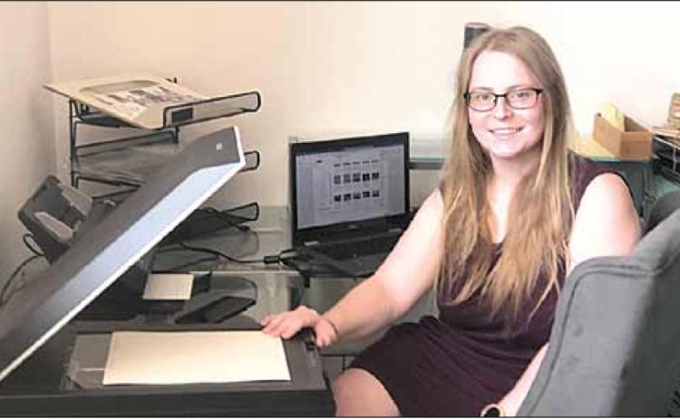 Lea Sobrilsky of Papillion spent the week scanning over 1,000 images into digital form. Sharla Sitzman Photo