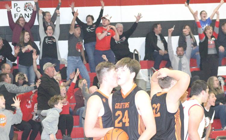 Pawnee City fans, bench players and Diller/Odell players react to Pawnee City’s last second three-point shot by Anthony Kling in Thursday night’s home season opener which lifted the Indians to a thrilling 50-49 victory. Paula Jasa/Republican