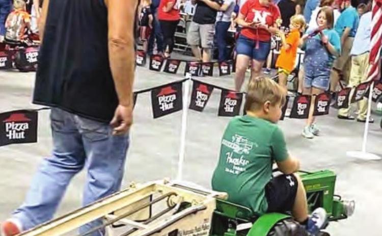 Above, Cooper Hunzeker competing in Tractor Pull