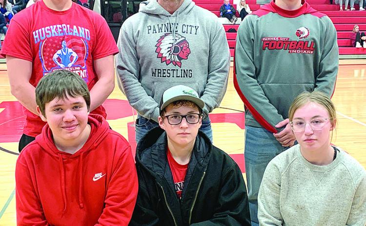 The Pawnee City Wrestling team was also recognized at the Pawnee City vs. HTRS Basketball game on Parent’s/Senior Night on Tuesday, January 16th. Pictured are front, from left: Justin Baehr, Luke Hunzeker, Kaylee Turnbull. Back row: Jesse McLaughlin, Head Coach Shane Maloley, Dylan Layne. Paula Jasa/Republican