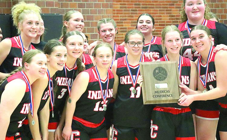 GIRLS’ CLASS B MUDECAS RUNNER-UP - Members of the Pawnee City girls’ basketball team proudly display their Class B Mudecas Runner-up trophy after their only loss to the #1 seeded Palmyra Lady Panthers on Friday. Paula Jasa/Republican