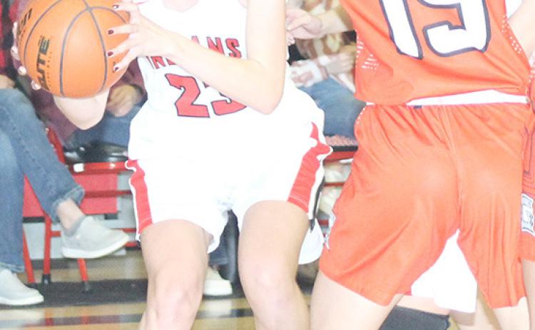 P.C.’s Madison Lytle (#23, left) drives the baseline against several D/O defenders. Madison scored 13 poimts against the Lady Griffins on Thursday night. Paula Jasa/Republican