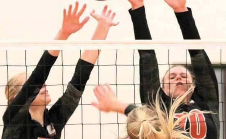 P.C.’s Sierra deKoning (#5, left) and Austin Branch (#10, right) go up for a block against Wymore Southern. photo courtesy of Lorrie Novak