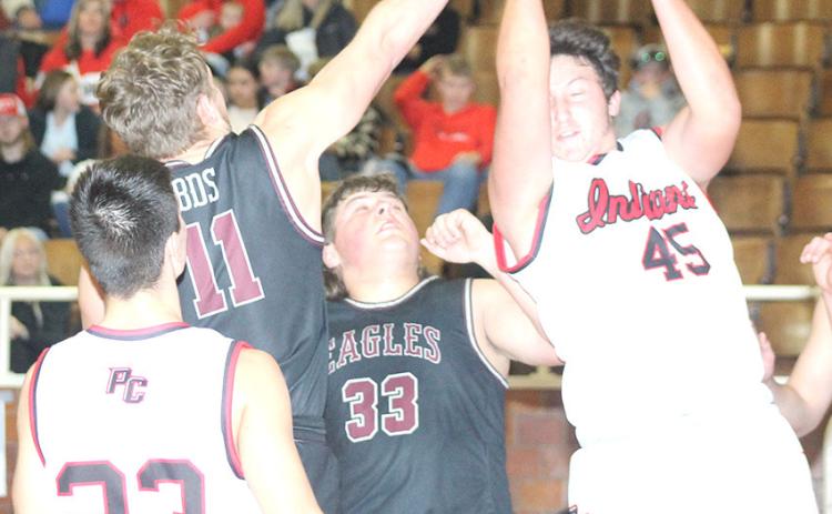 P.C.’s Joey Marteney (#45, right) pulls down a tough defensive rebound as teammate Anthony Kling (#23, left) looks on in the Class B Boys’ Mudecas Championship game. Pawnee City defeated BDS 54-50 on Saturday to claim the 1st place trophy. Paula Jasa/Republican