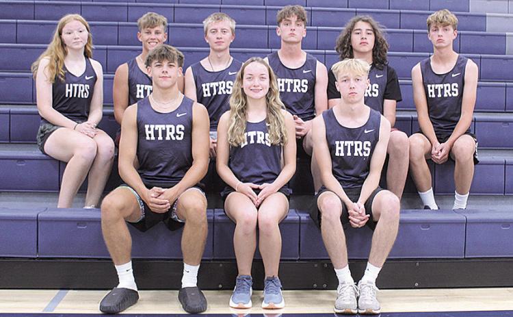 Members of the 2026 HTRS Cross Country team are (L-R front row) Seniors: Kameon Dettmann, Grayson Sherman and Axton Wamsley Second Row: Shawnna Richey, Preston Mezger, Ewan Guenther, Ty Dunekacke, Michael Wanek-Flores and Tate Dunekacke. Head Coach: Madi Bredemeier. Assistant Coach: Michelle Glathar