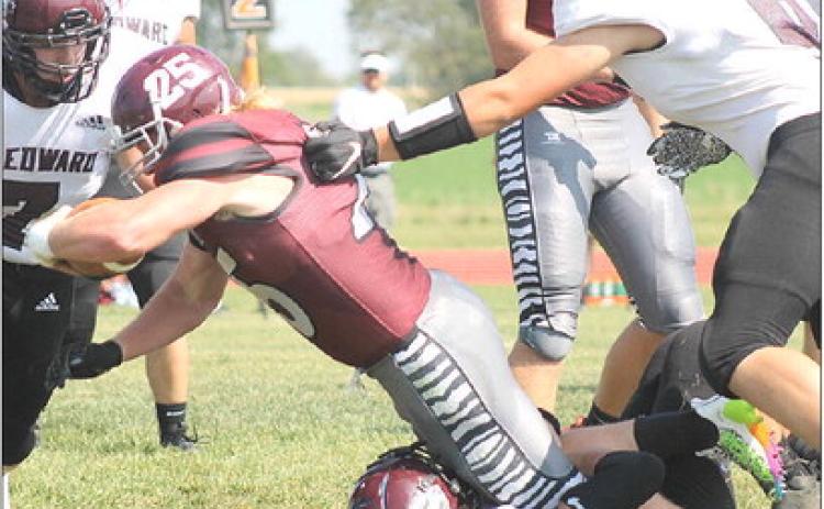 LHS’ Tristen Ray (#25, center) dives for more yardage past three St. Edward defenders. Ray had 119 yards of rushing with 3 TD’s against the Beavers. Paula Jasa/Republican