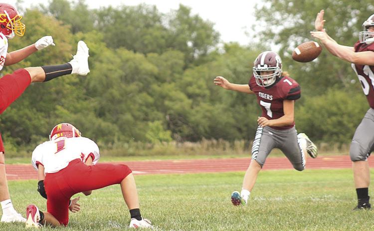 LHS’ Brody Wright (#61, right) blocks a Red Cloud PAT attempt early in the game as teammate Cashton Steinacher (#7, right) also rushes in. Wright blocked two PAT kicks in the game which LHS lost, 26-72. Paula Jasa/Republican