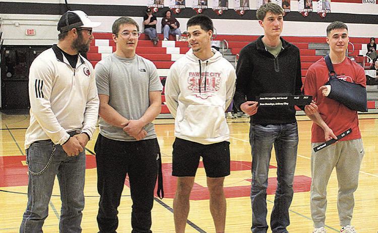 Last spring's 4x100 relay team was recognized for setting a new record time. The award was presented to the team by Ben Blecha, a member of the previous record holding team. Pictured above, from left: Ben Blecha, Jesse McLaughlin, Anthony Kling, Drew Menninga and Jett Farwell