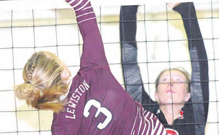 LHS’ Katelyn Sanders goes up at the net against P.C.’s Hallye Friedly (#8) in Thursday night’s game. Paula Jasa/Republican