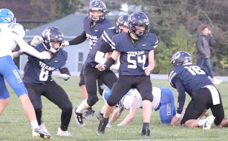 The HTRS Titans hosted the Nebraska City Lourdes in a very high-scoring game for Homecoming on Friday night, October 7th. Unfortunately, the Titans lost by a 50-68 count. Pictured are some of the HTRS offensive players including Emmett Glathar (#9), Hunter Bohling (#22), Brogan Dunlap (center); Jonathan Koch (#54) and Brandt Leech (#18, right). photo courtesy of Kelly Glathar