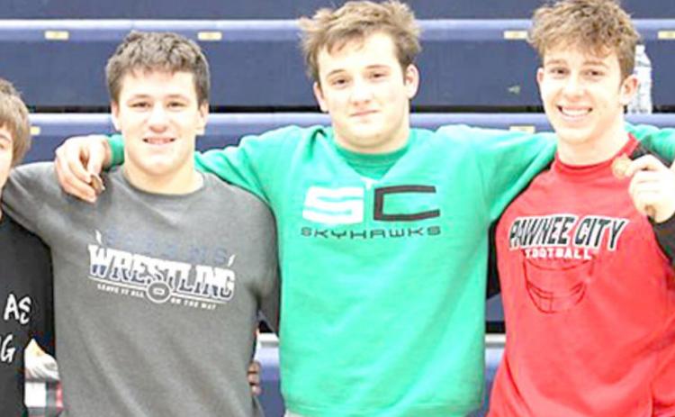 Four HTRS/P.C. Wrestlers medaled at the Cross County Meet held on Saturday, January 16th where the Titans faced some tough competition. Twenty teams were represented at the meet and after a long day of wrestling, the four members of the HTRS/PC team who medaled were from left, Jakob Richey, 6th place; Aiden Worthey, 3rd place; Isaac Bitner, 4th place and Andy Maloley, 4th place. photo provided