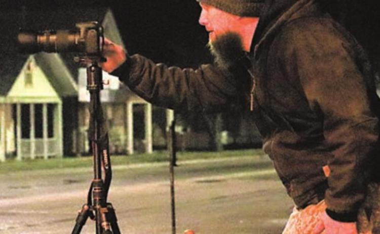 Delton Rhodes at work photographing in Pawnee City. Ray Kappel/Republican
