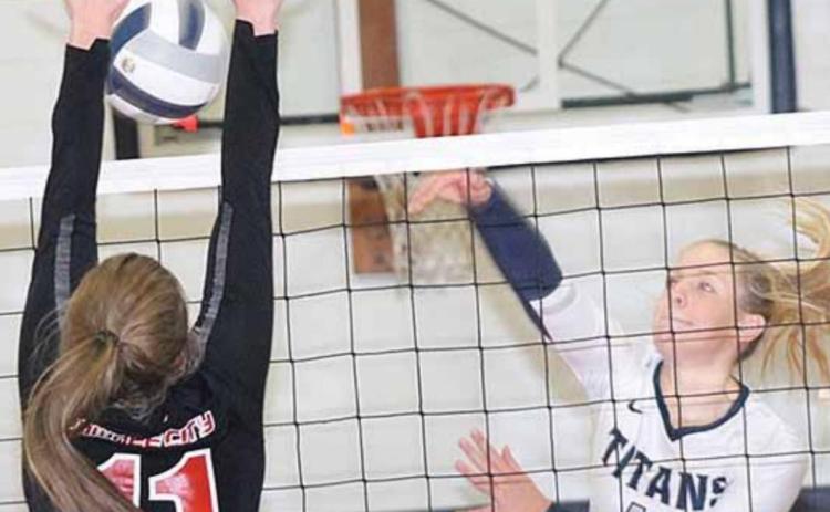 P.C.’s Madison Branek (#11, left) gets her hands on an ace block against HTRS’ Katilyn Glathar (#11, right). Paula Jasa/Republican
