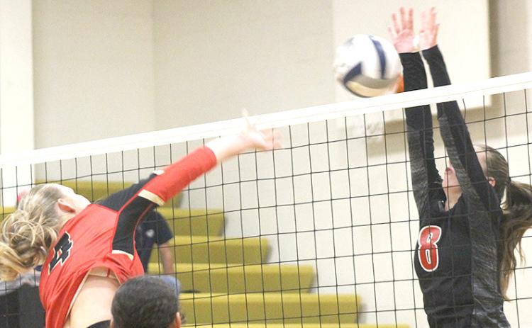 P.C.’s Hallye Friedly (#8, right) goes up for a block against a JCC hitter. Paula Jasa/Republican