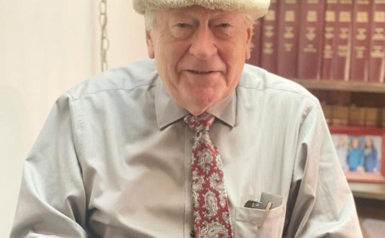 Joe Stehlik wears a hat his dad wore
