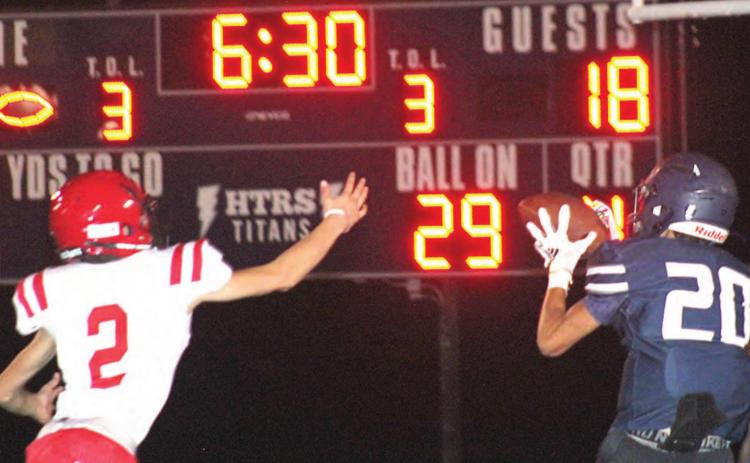HTRS’ Nic Knudson (#20) catches the final touchdown pass of the game against Wymore Southern on Friday night. Knudson had 4 catches for 119 yards. Paula Jasa/Republican