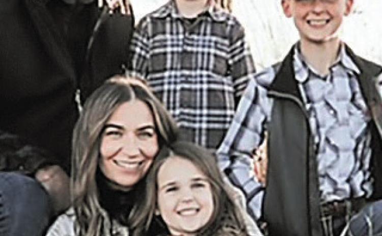 The Johnson Family Back row is Brady, Stetson then Rhett.Front row is Cortney with Rowan on her lap