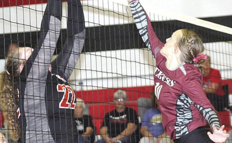 Pawnee City’s Adelyn Sisco (#22, left) and Lewiston’s Jenna Anderson (#10, right) go head to head at the net. Paula Jasa/Republican